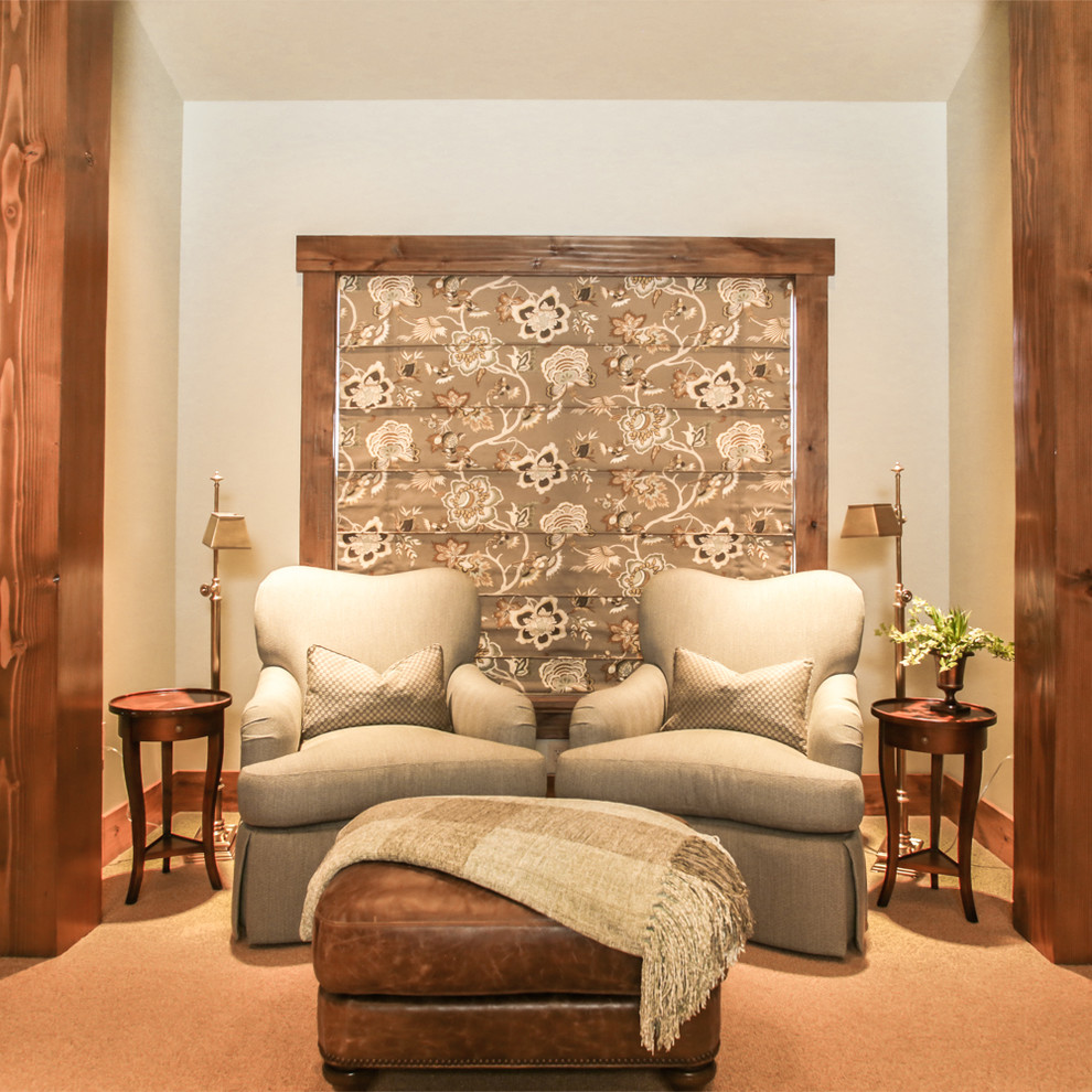 Example of a huge mountain style master carpeted bedroom design in Other with beige walls