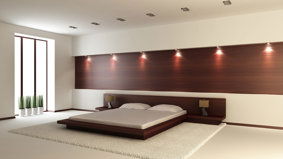 Imagen de dormitorio principal moderno grande sin chimenea con paredes beige y moqueta