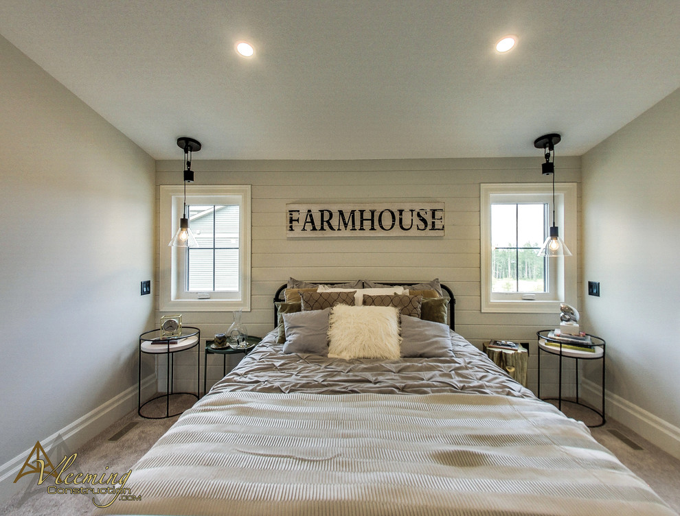 This is an example of a large country master bedroom in Other with beige walls, carpet and grey floors.