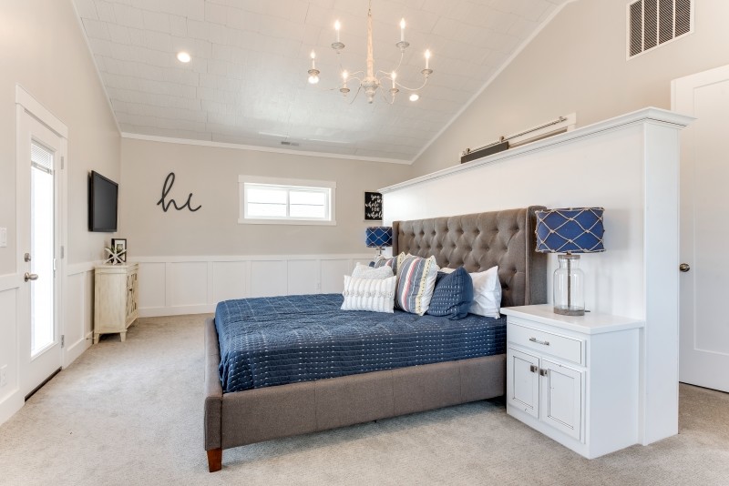 Bedroom - large coastal master carpeted and beige floor bedroom idea in Salt Lake City with gray walls