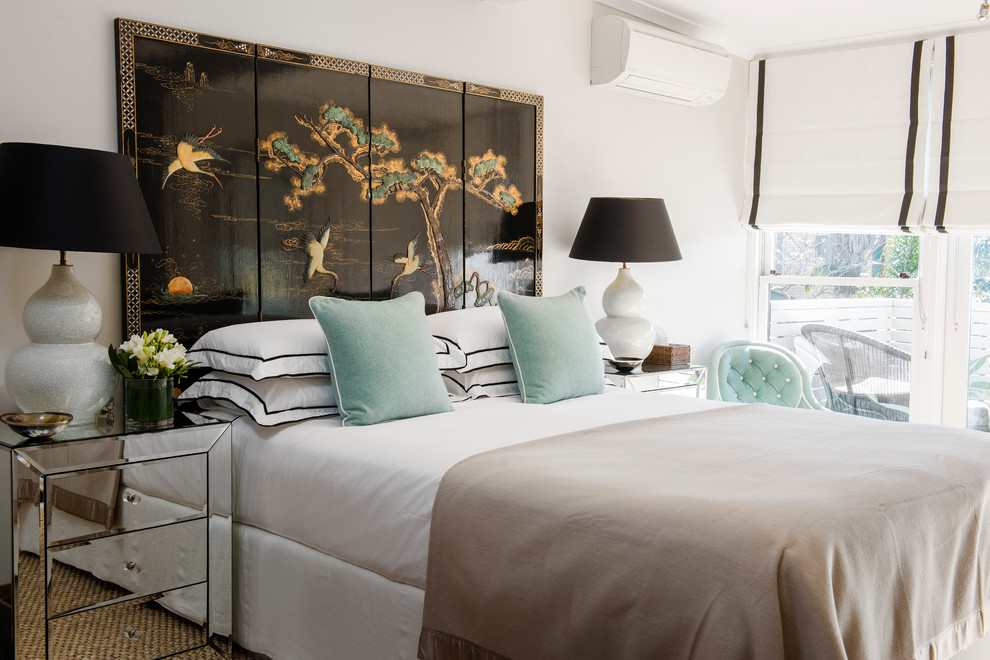 Elegant bedroom photo in Sydney with white walls
