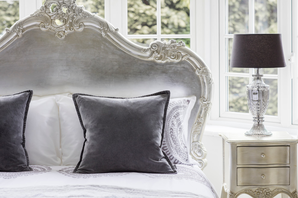 This is an example of a classic master and grey and silver bedroom in Sussex.