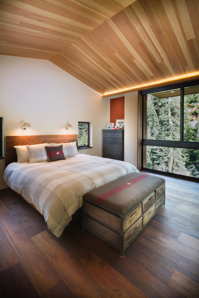 Inspiration for a contemporary master bedroom in San Francisco with orange walls and medium hardwood flooring.