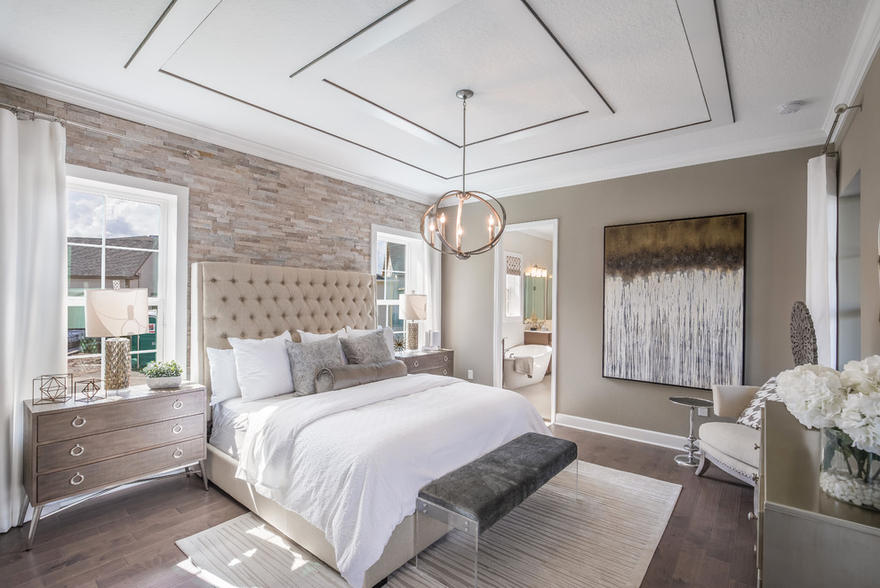Inspiration for a transitional master medium tone wood floor and brown floor bedroom remodel in Orlando with brown walls