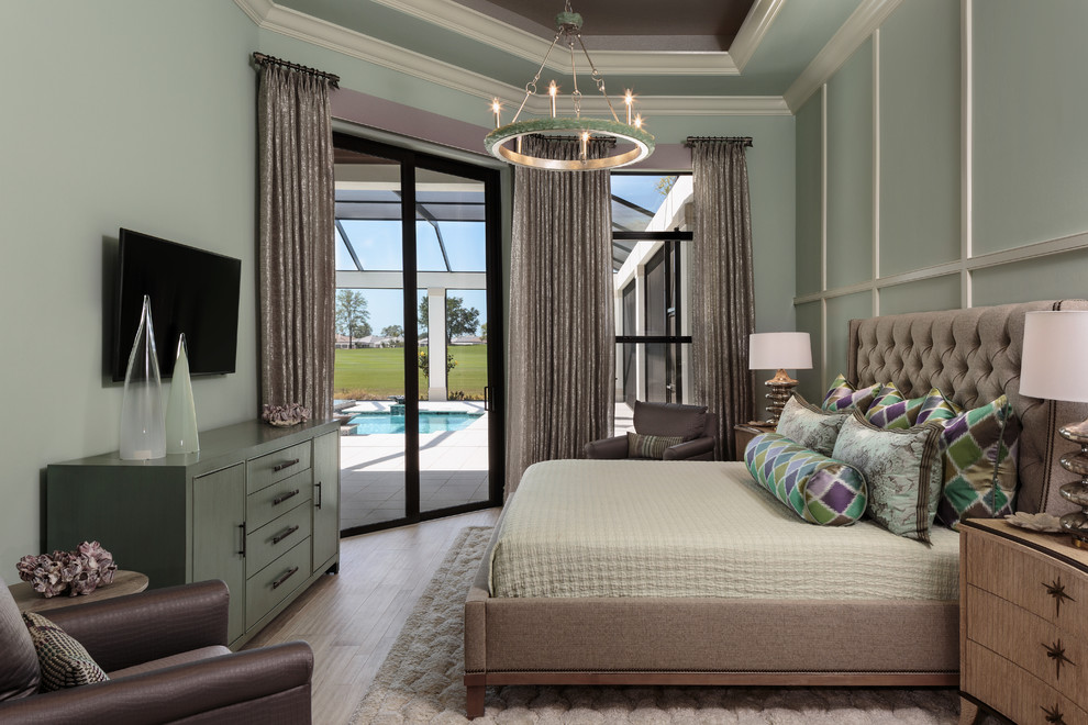 Bedroom - large transitional master light wood floor bedroom idea in Miami with green walls