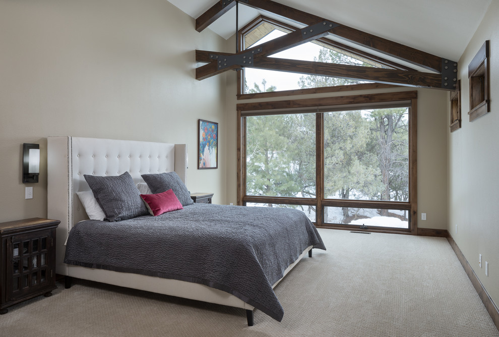 Example of a mountain style carpeted and beige floor bedroom design in Albuquerque with beige walls