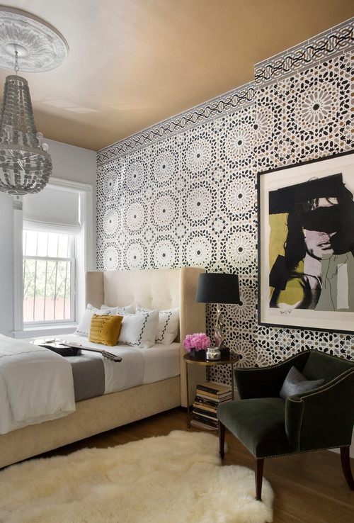 A bedroom with a white bed and black & white patterned wallpaper, featuring a white ceiling paint colour.
