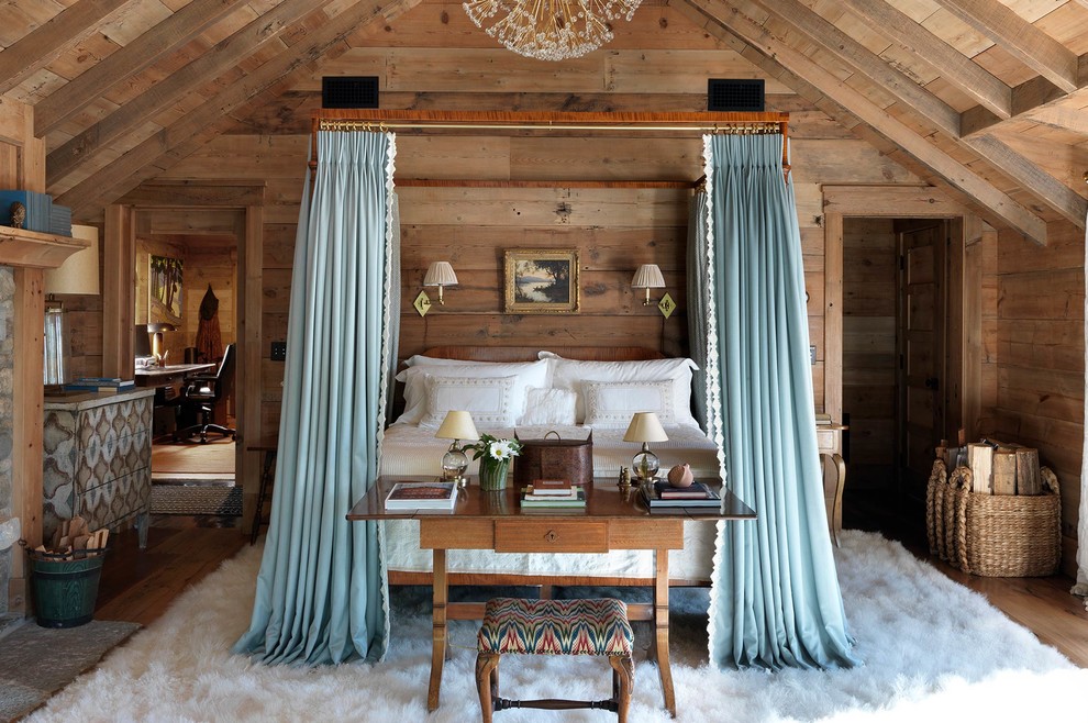 This is an example of a rustic master bedroom in Other with brown walls.