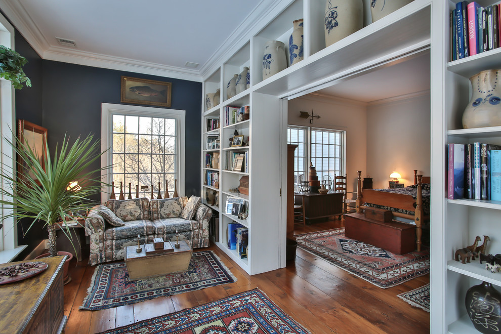 Inspiration for a rural bedroom in Manchester with grey walls, medium hardwood flooring and no fireplace.