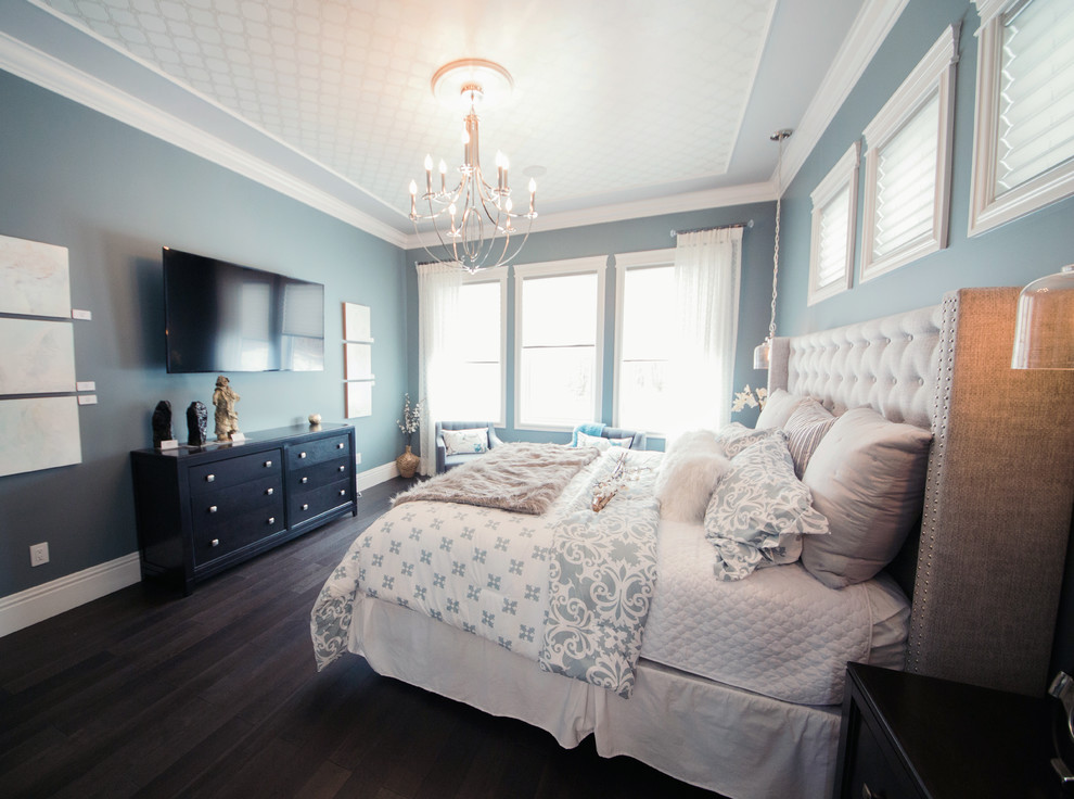 Design ideas for a medium sized classic master bedroom in Edmonton with blue walls and dark hardwood flooring.