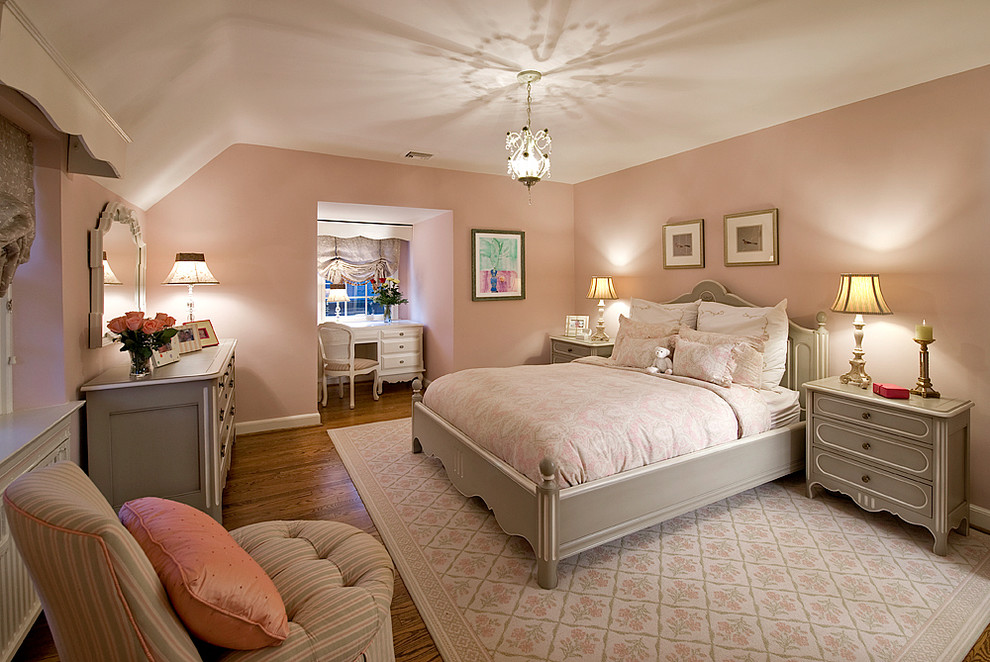 Medium sized shabby-chic style guest bedroom in Philadelphia with pink walls, dark hardwood flooring, brown floors and feature lighting.