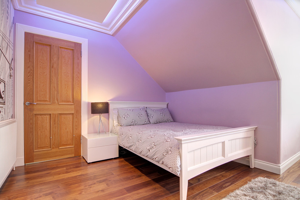 Design ideas for a medium sized contemporary guest bedroom in Glasgow with pink walls and dark hardwood flooring.