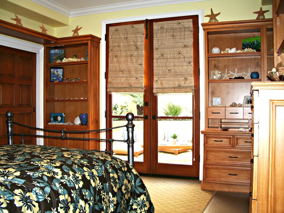 Example of a mid-sized island style guest carpeted bedroom design in Orange County with yellow walls