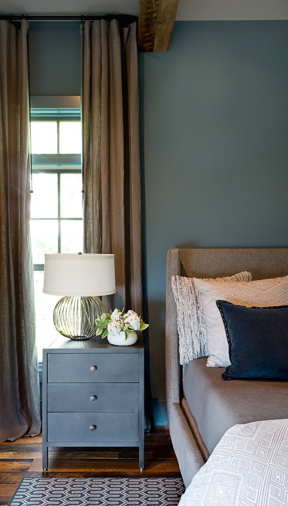 Example of a mid-sized transitional master medium tone wood floor and brown floor bedroom design in Other with blue walls