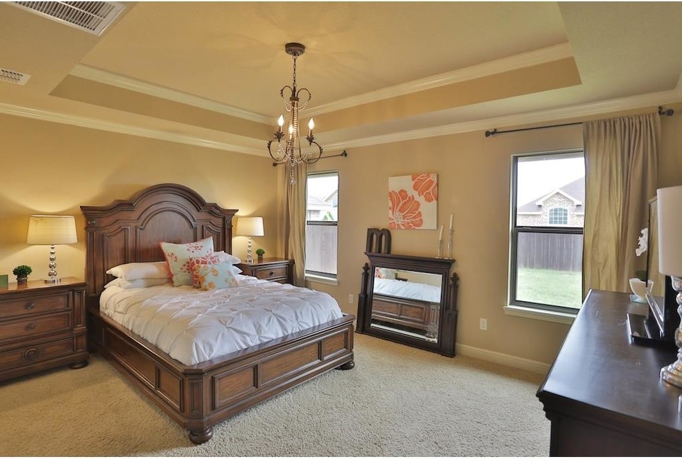 Inspiration for a large traditional master bedroom in Atlanta with beige walls, carpet and no fireplace.