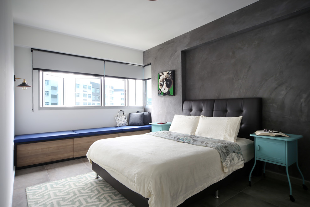 Modelo de dormitorio urbano con paredes grises y suelo de cemento