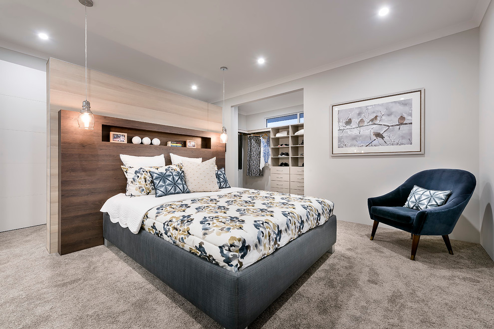 Example of a large trendy master carpeted bedroom design in Perth with white walls