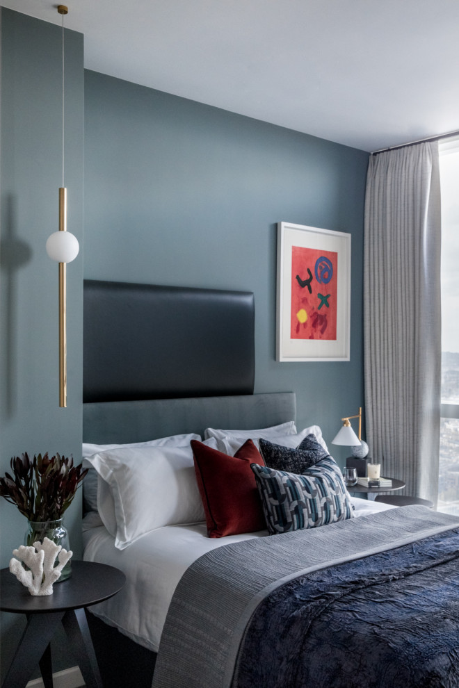 Inspiration for a medium sized contemporary guest bedroom in London with grey walls, carpet and grey floors.