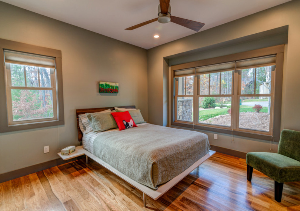Bedroom - mid-sized craftsman guest light wood floor bedroom idea in Other with beige walls