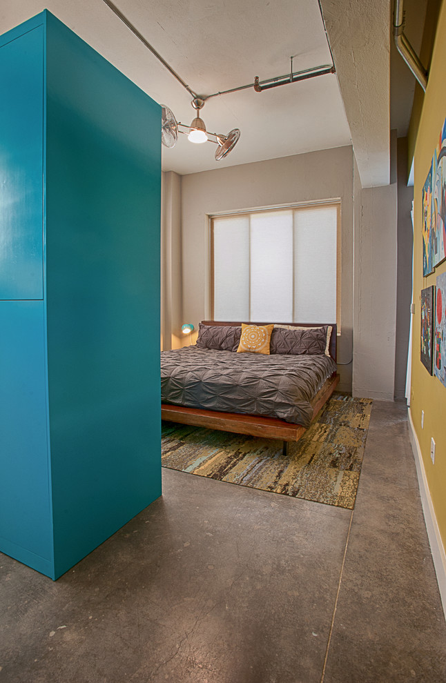 Example of an urban bedroom design in Austin