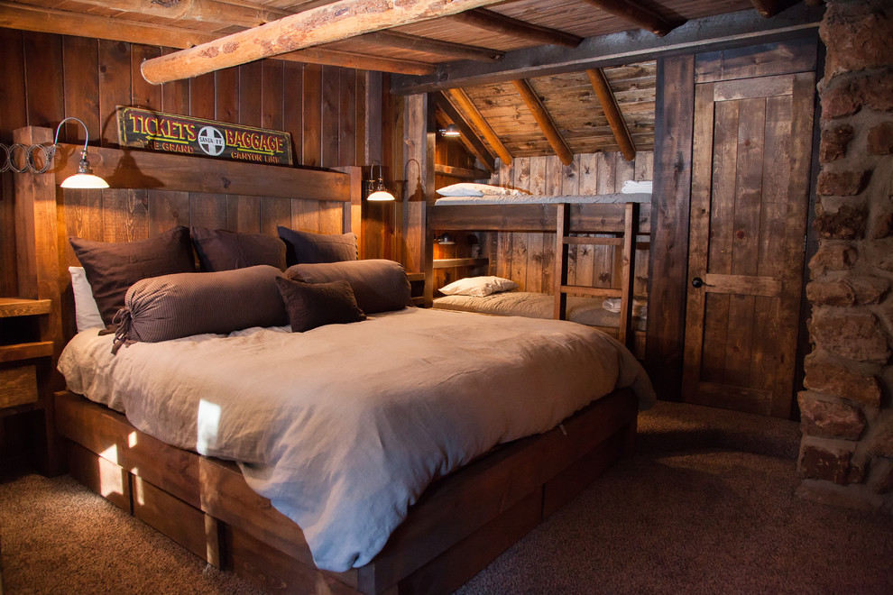 Small mountain style carpeted bedroom photo in Phoenix with brown walls