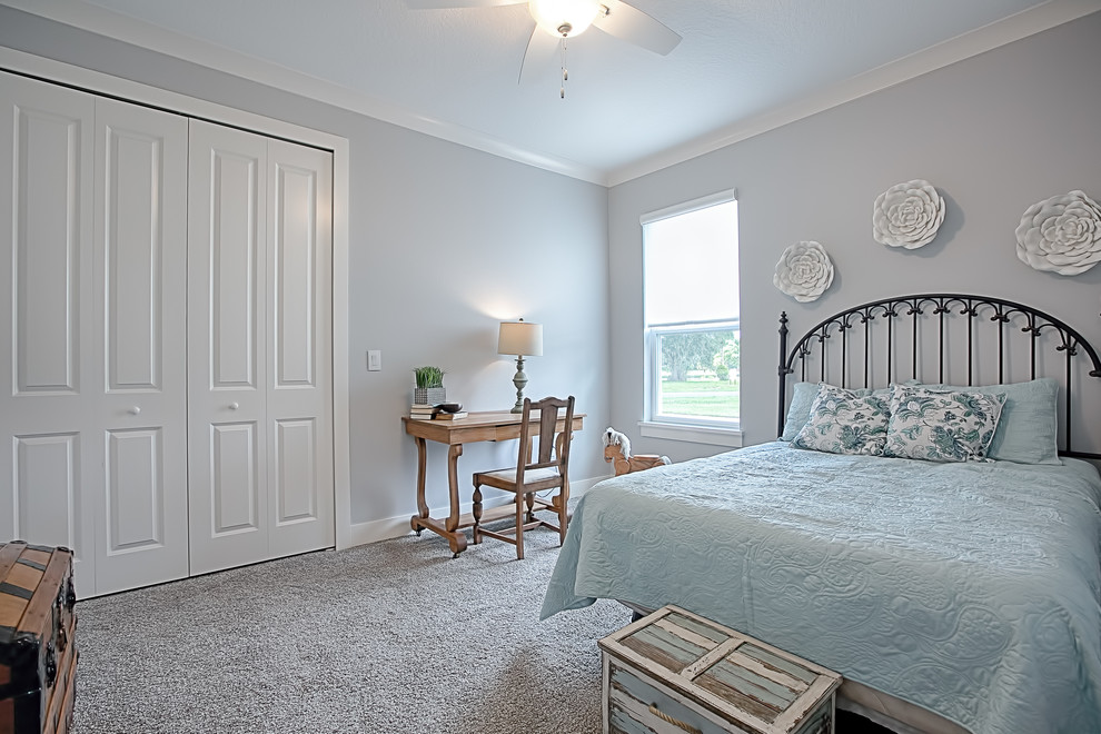 Photo of a contemporary guest bedroom in Orlando with grey walls, carpet and grey floors.