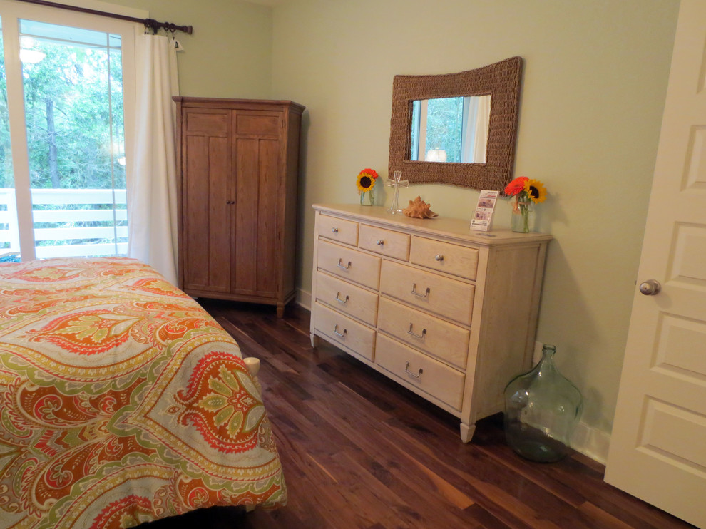 Bedroom - mid-sized coastal master medium tone wood floor bedroom idea in Other with green walls