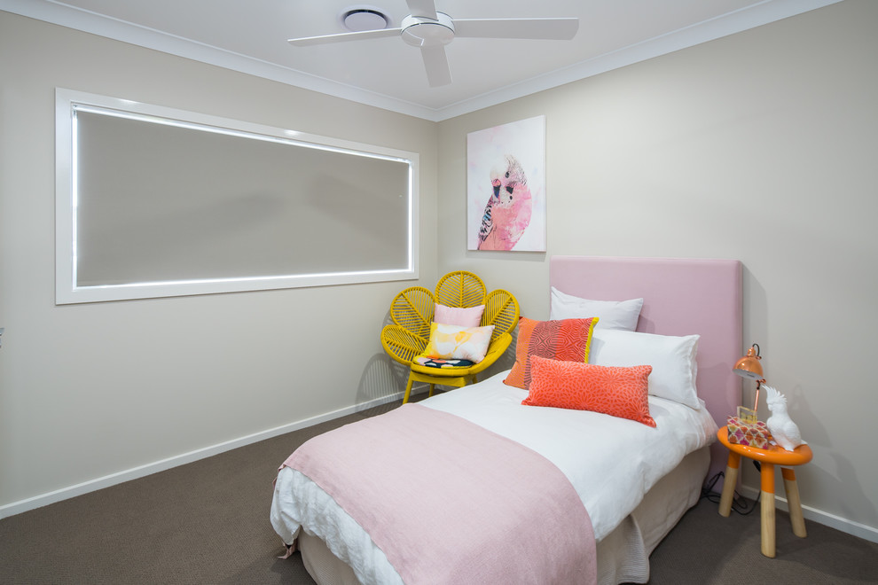 This is an example of a small contemporary guest bedroom in Brisbane with beige walls and carpet.