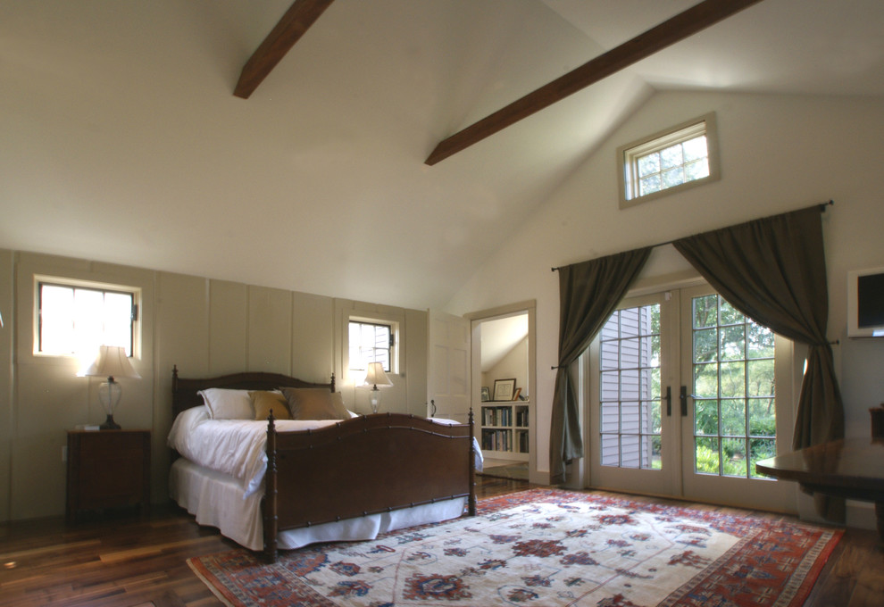 Mid-sized elegant guest dark wood floor bedroom photo in Boston with beige walls