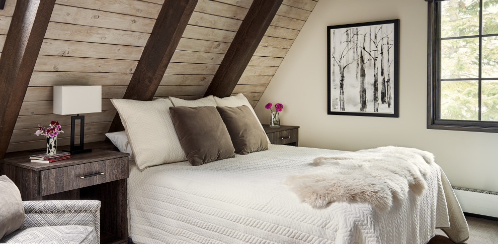 Foto di una camera da letto stile rurale con pareti grigie, moquette e pavimento grigio