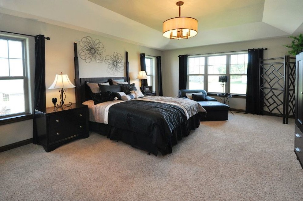 Mid-sized master carpeted bedroom photo in Milwaukee with beige walls and no fireplace