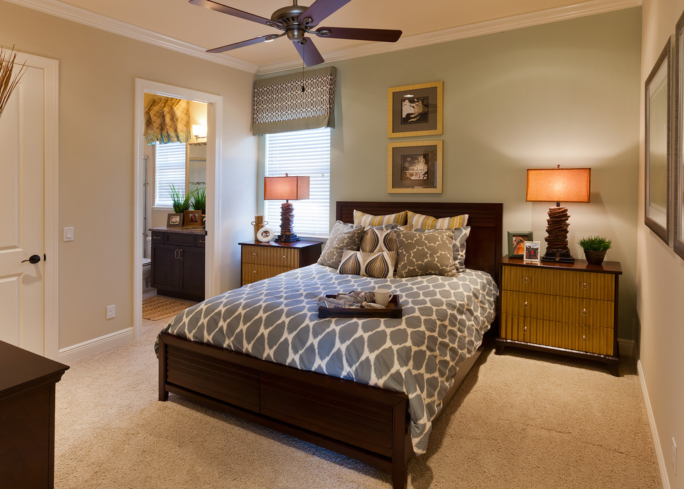Photo of a large classic guest bedroom in Tampa with grey walls and carpet.
