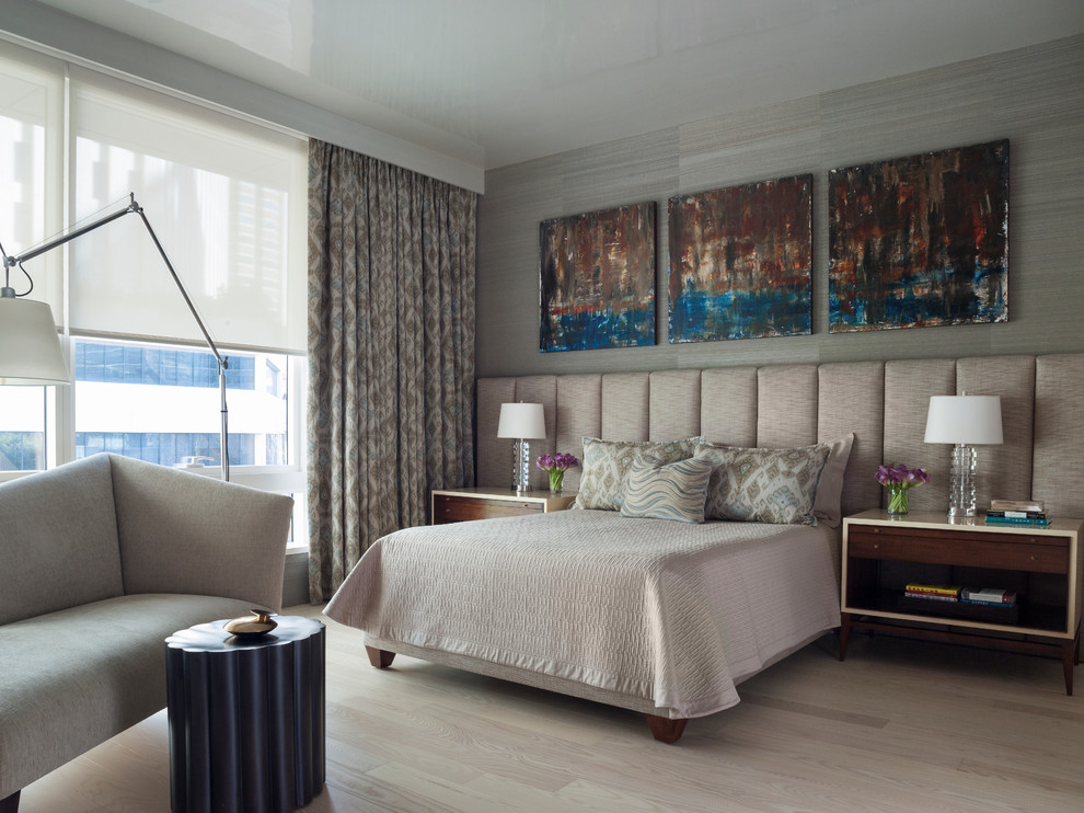 Contemporary bedroom in San Francisco with grey walls and light hardwood flooring.