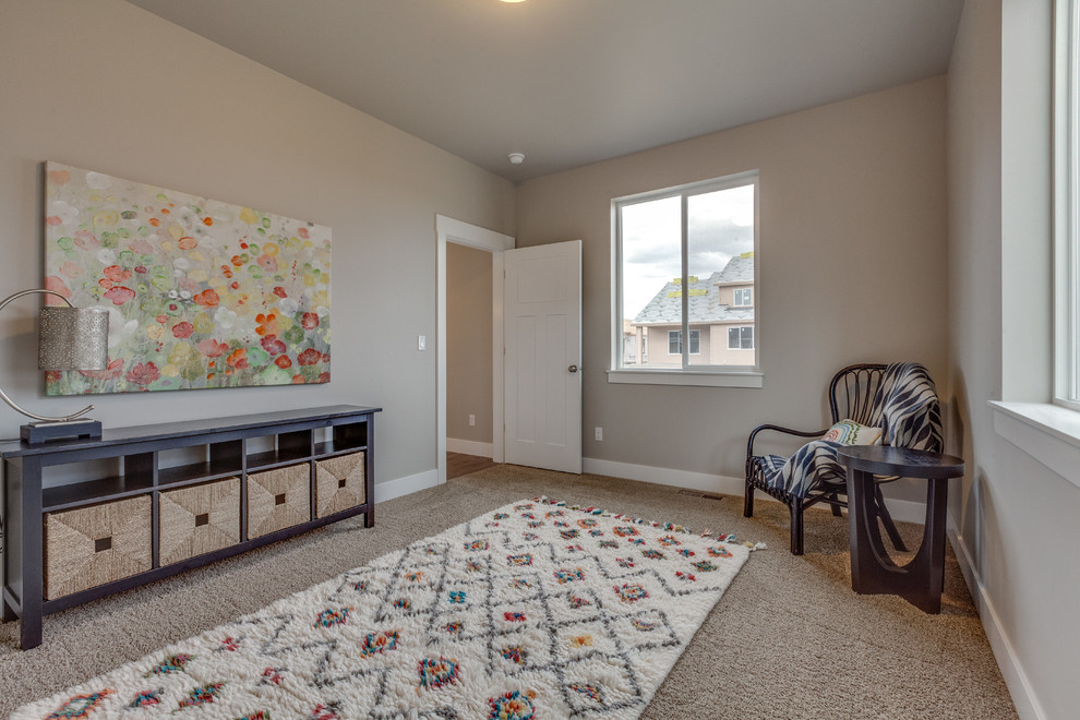 Large guest bedroom in Boise with grey walls and carpet.