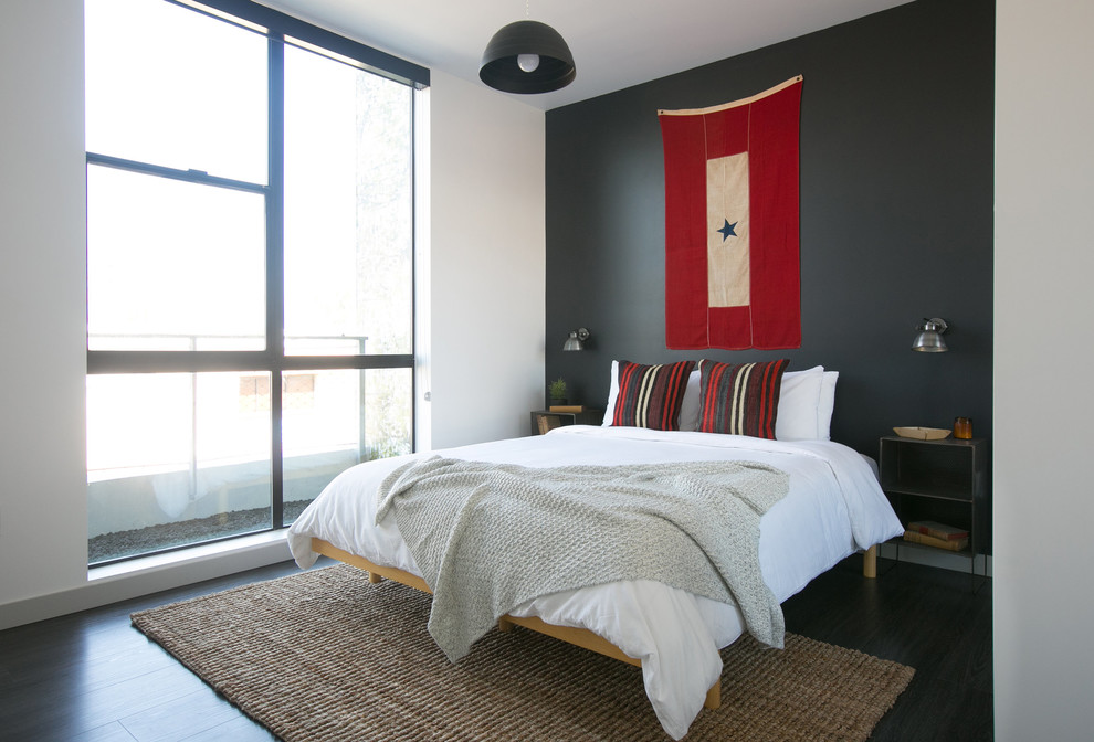 Example of a minimalist bedroom design in San Diego with gray walls