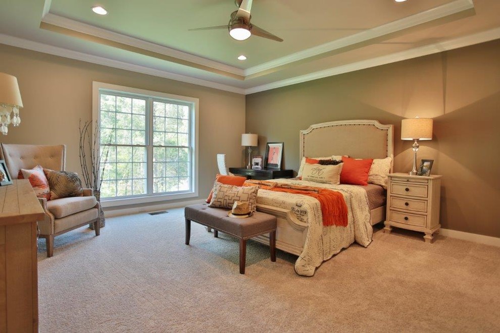 Example of a large transitional master carpeted bedroom design in Louisville with gray walls