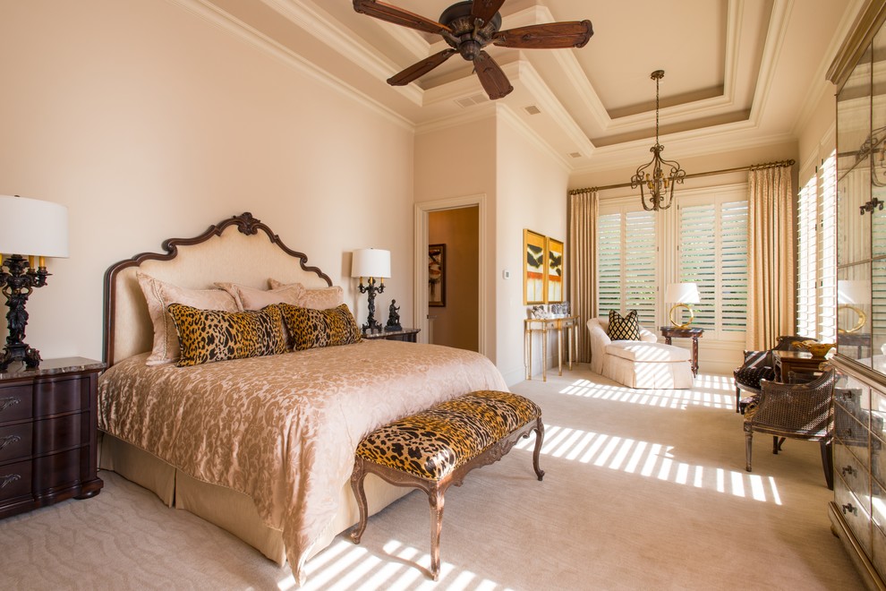 This is an example of a large bohemian master bedroom in Dallas with beige walls, carpet and no fireplace.