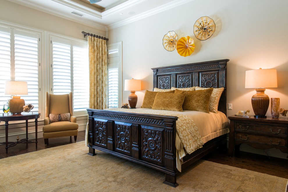 Design ideas for a large classic master bedroom in Dallas with beige walls, dark hardwood flooring and no fireplace.