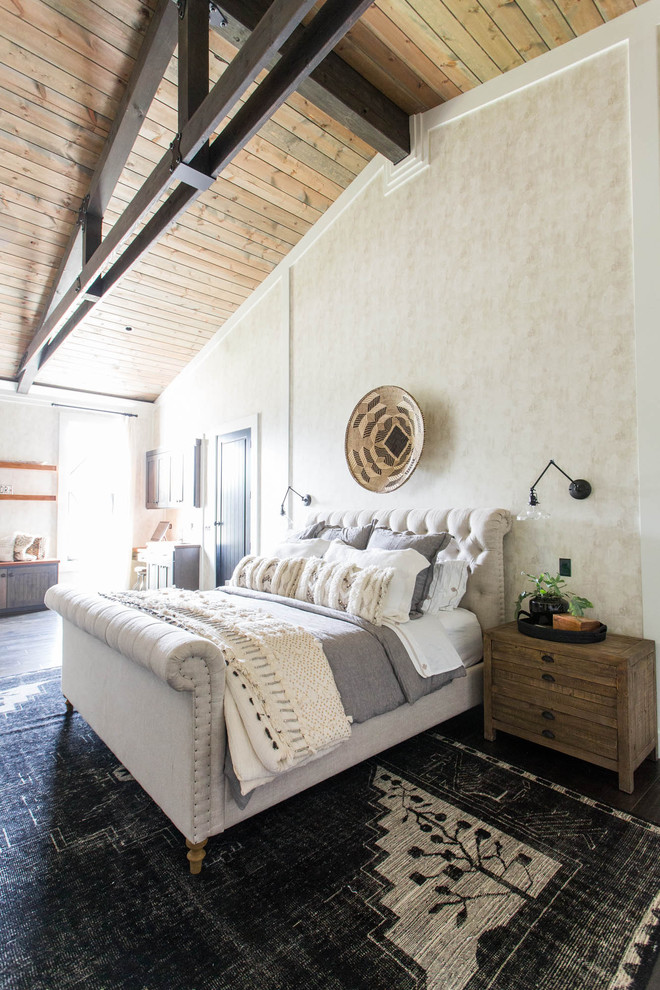 Bedroom - farmhouse master black floor bedroom idea in Sacramento with beige walls