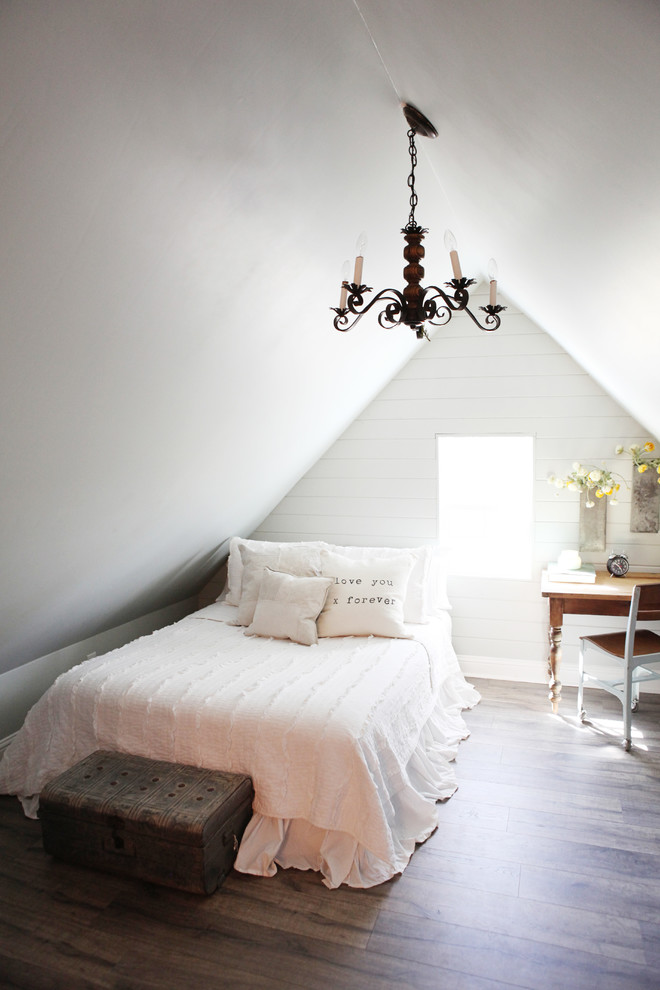 Design ideas for a small rural guest bedroom in Austin with grey walls, medium hardwood flooring and no fireplace.