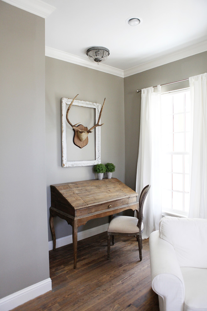 Bedroom - small farmhouse master medium tone wood floor bedroom idea in Austin with gray walls