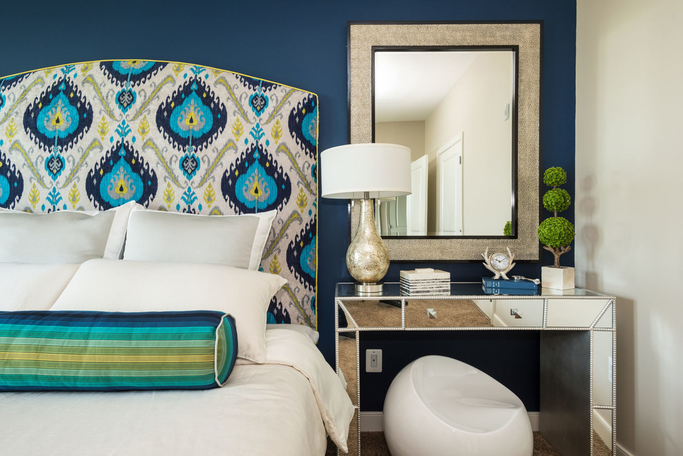Example of a transitional bedroom design in DC Metro with blue walls