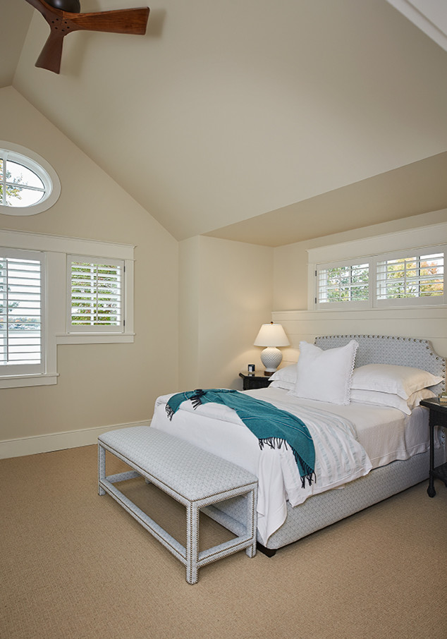 Inspiration for a mid-sized transitional guest carpeted and beige floor bedroom remodel in Grand Rapids with beige walls