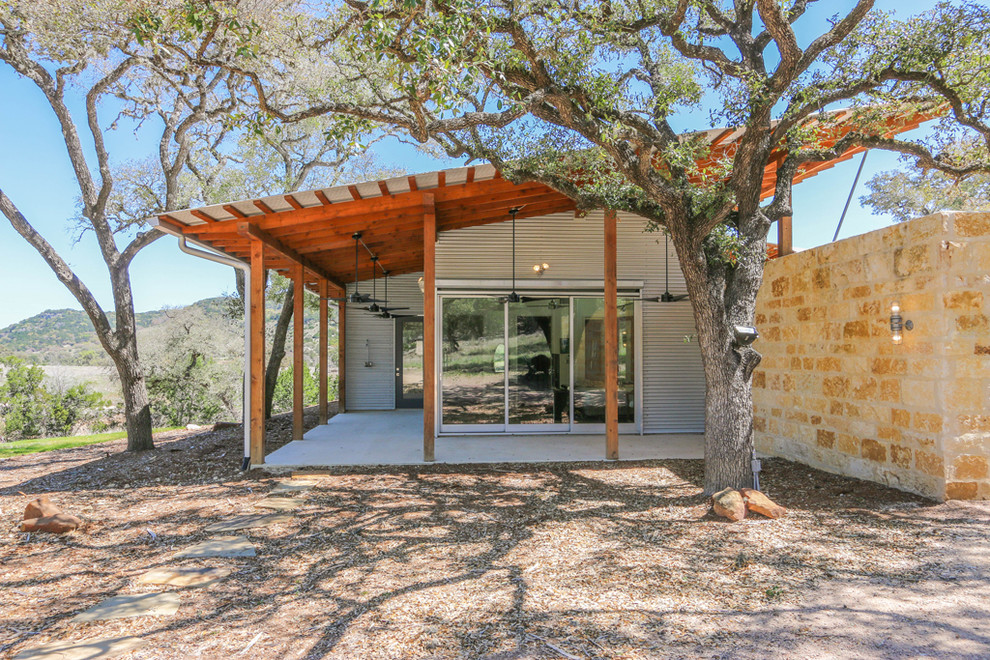 Inspiration for a rustic bedroom remodel in Austin