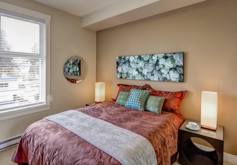 Example of a trendy master carpeted bedroom design in Vancouver with beige walls