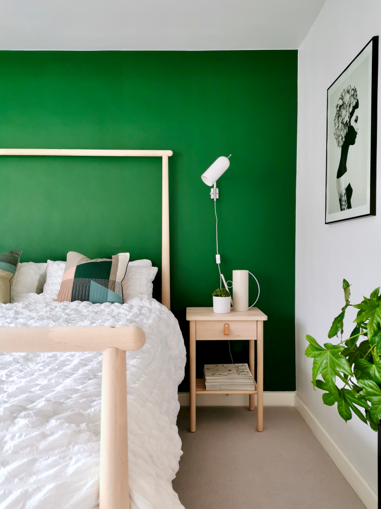 Inspiration for a medium sized scandi guest bedroom in Other with green walls, carpet and grey floors.
