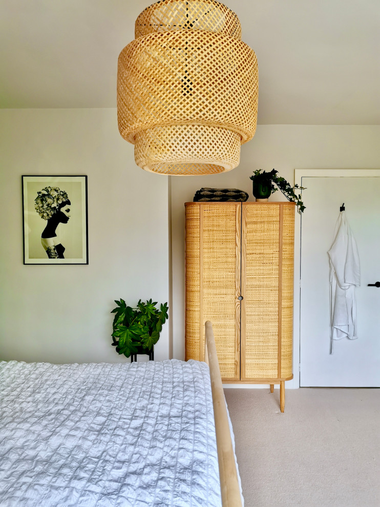 Medium sized scandi guest bedroom in Other with green walls, carpet and grey floors.