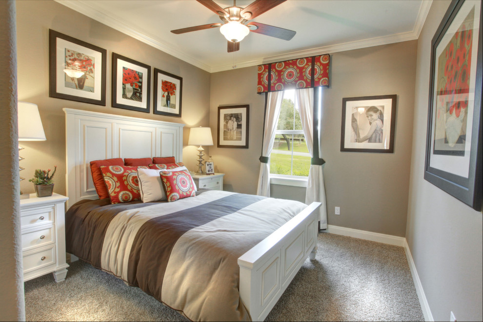 Design ideas for a traditional guest bedroom in Austin with beige walls and carpet.