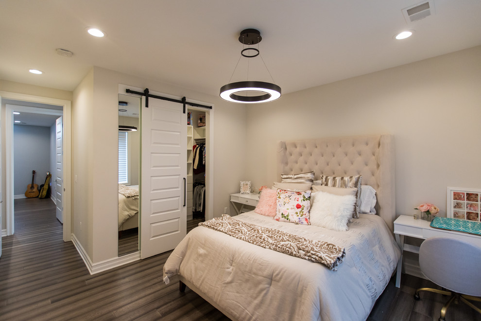 Bedroom - transitional dark wood floor and brown floor bedroom idea in Detroit with beige walls