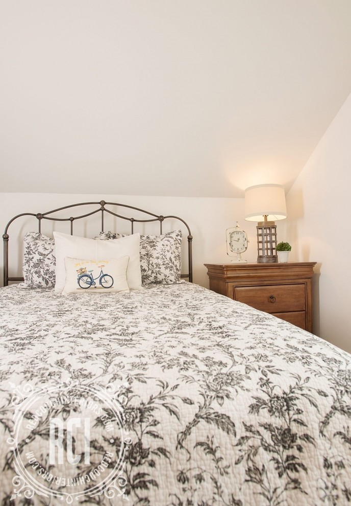 Example of a large country master carpeted and beige floor bedroom design with white walls